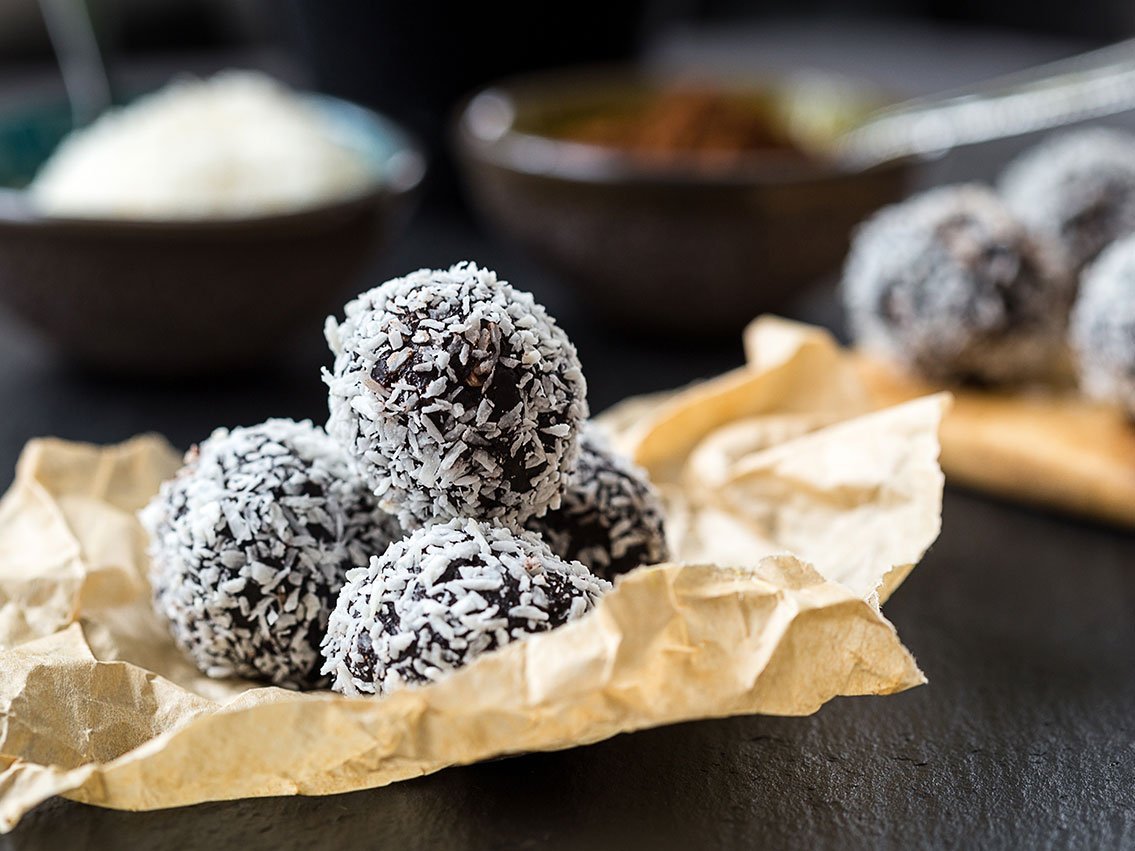 Homemade Healthy Paleo Raw Chocolate Truffles With Nuts, Dates And Coconut Flakes