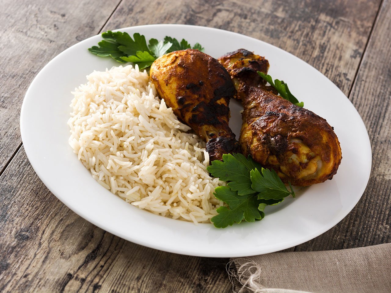 Roasted Tandoori Chicken With Basmati Rice In Plate On Wooden Ta