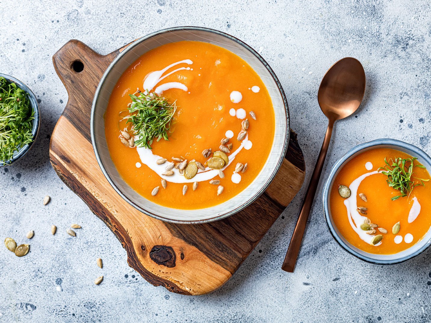 Vegetarian Autumn Pumpkin And Carrot Soup With Cream, Seeds And