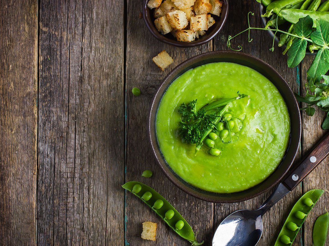 Green Peas Soup On Rustic Background