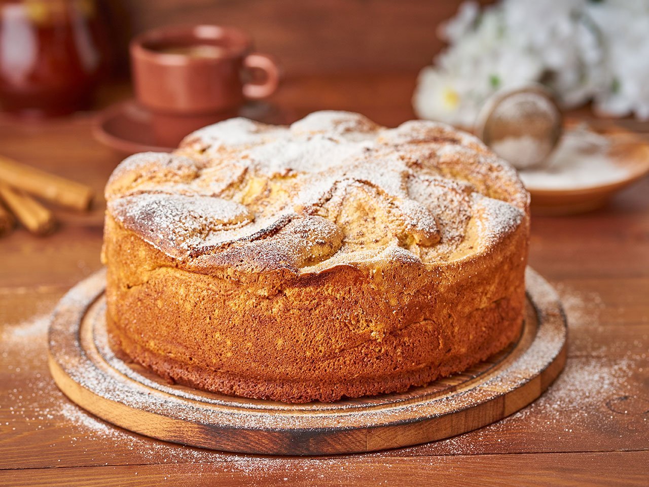 Apple French Cake With Apples, Cinnamon On Dark Wooden Kitchen Table, Side View