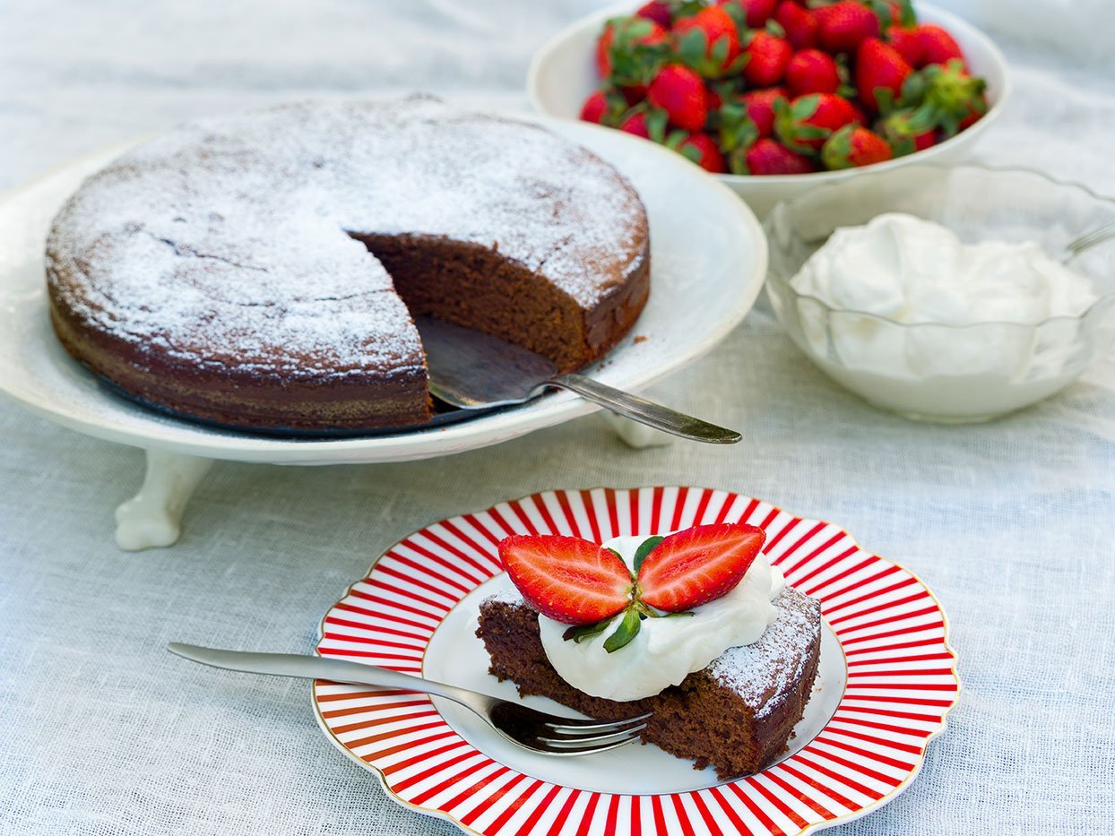 Homemade Chocolate Cake With Whipped Cream And Strawberries