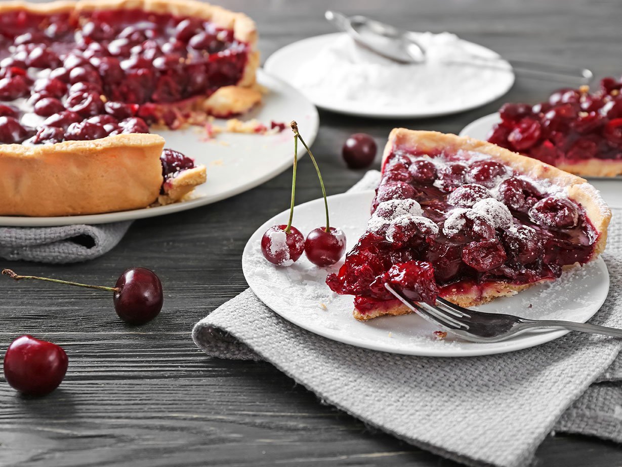 Tasty Homemade Cherry Pie On Wooden Table