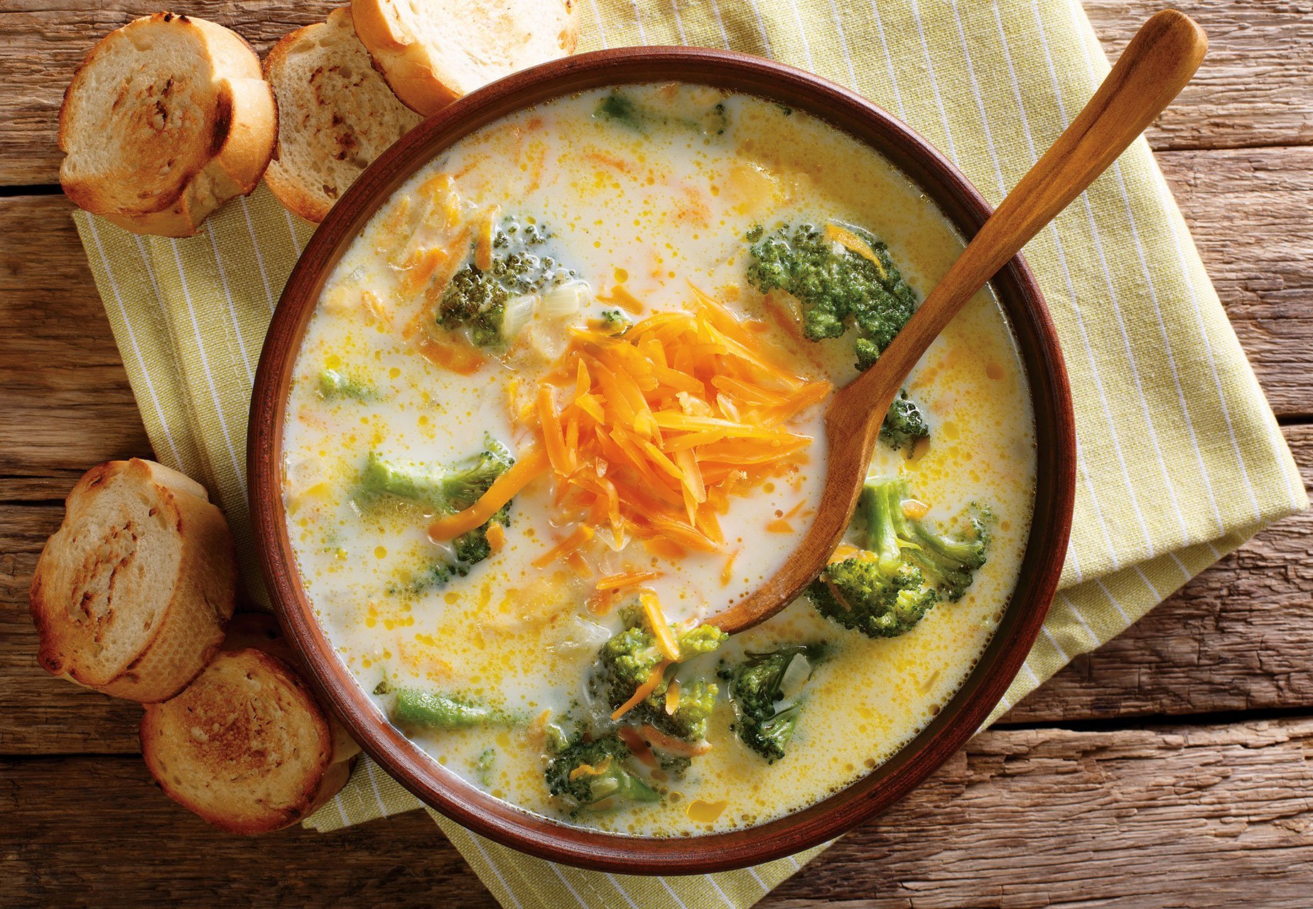 Delicious Cheesy Broccoli Soup With Vegetables In A Bowl With To