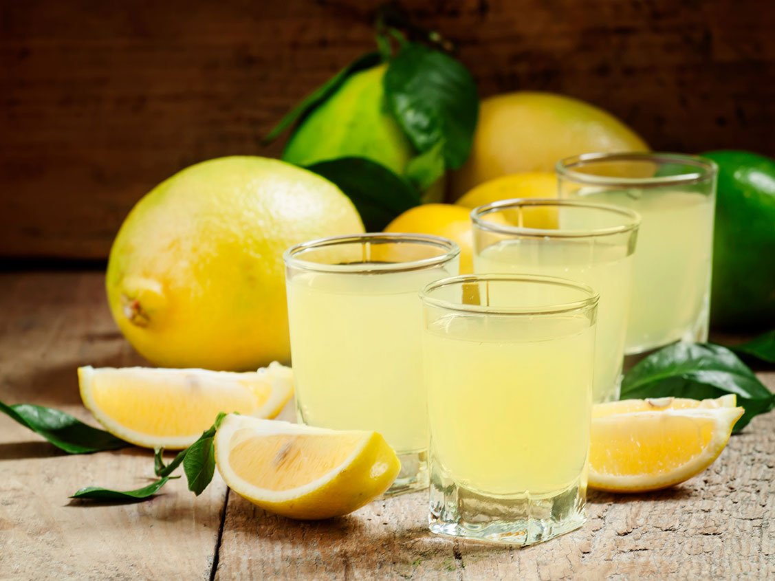 Traditional Homemade Lemon Liqueur Limoncello And Fresh Citrus O