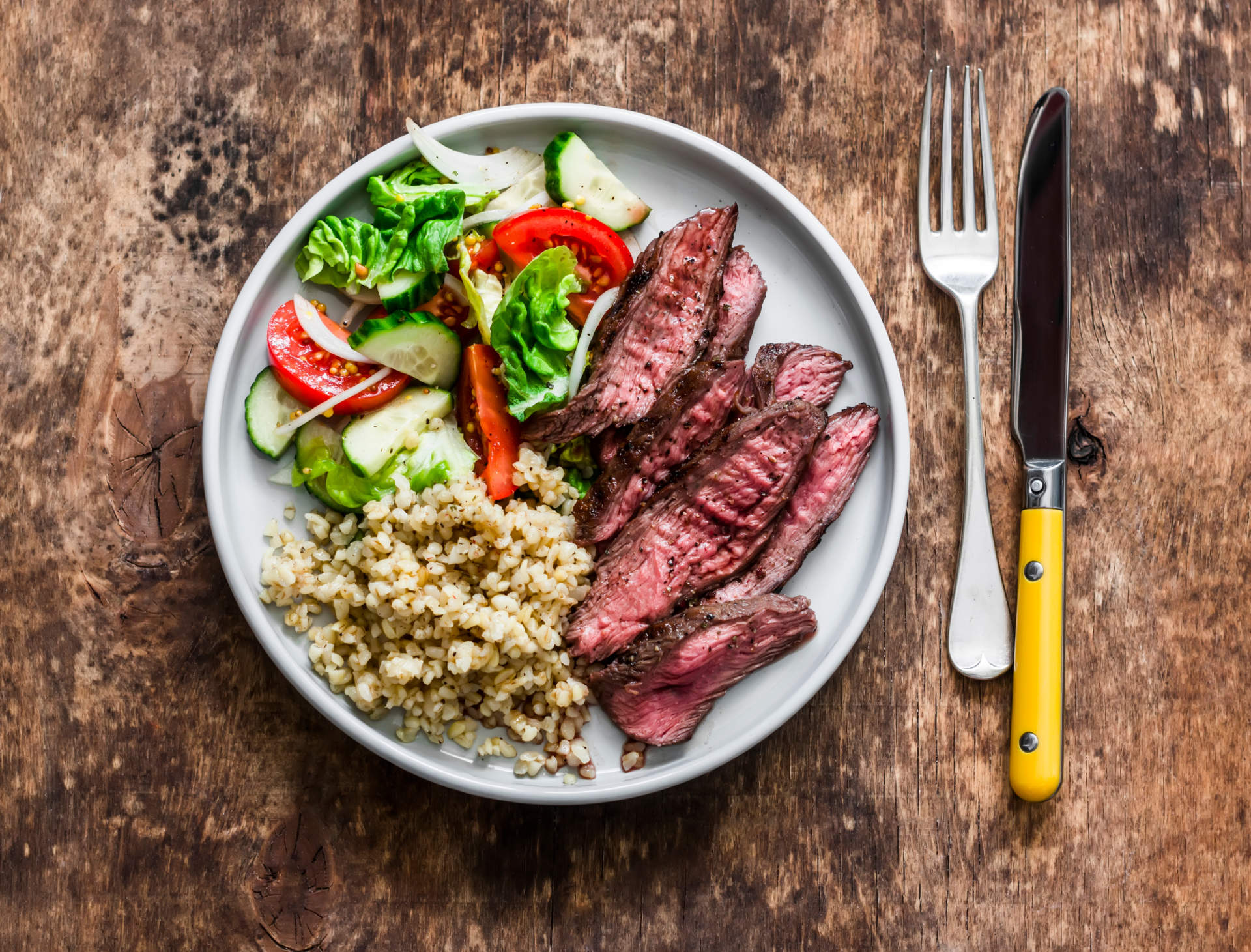 Delicious Lunch Bulgur, Fresh Vegetable Salad And Steak On A W