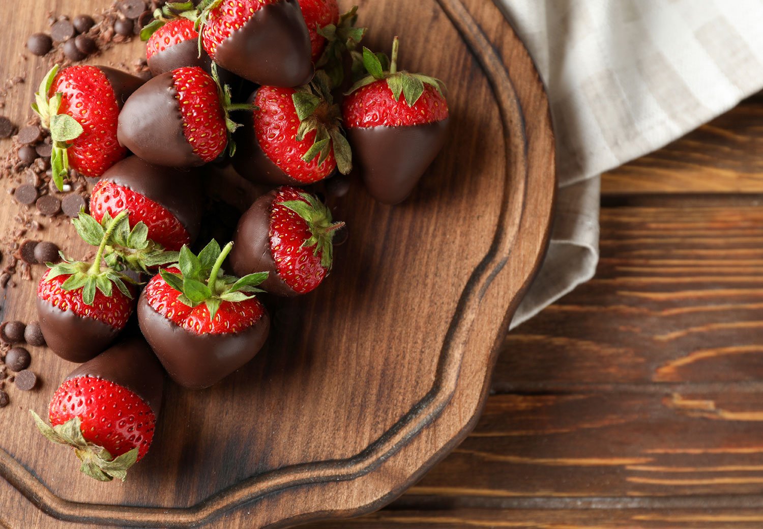 Board With Tasty Chocolate Dipped Strawberries On Wooden Table