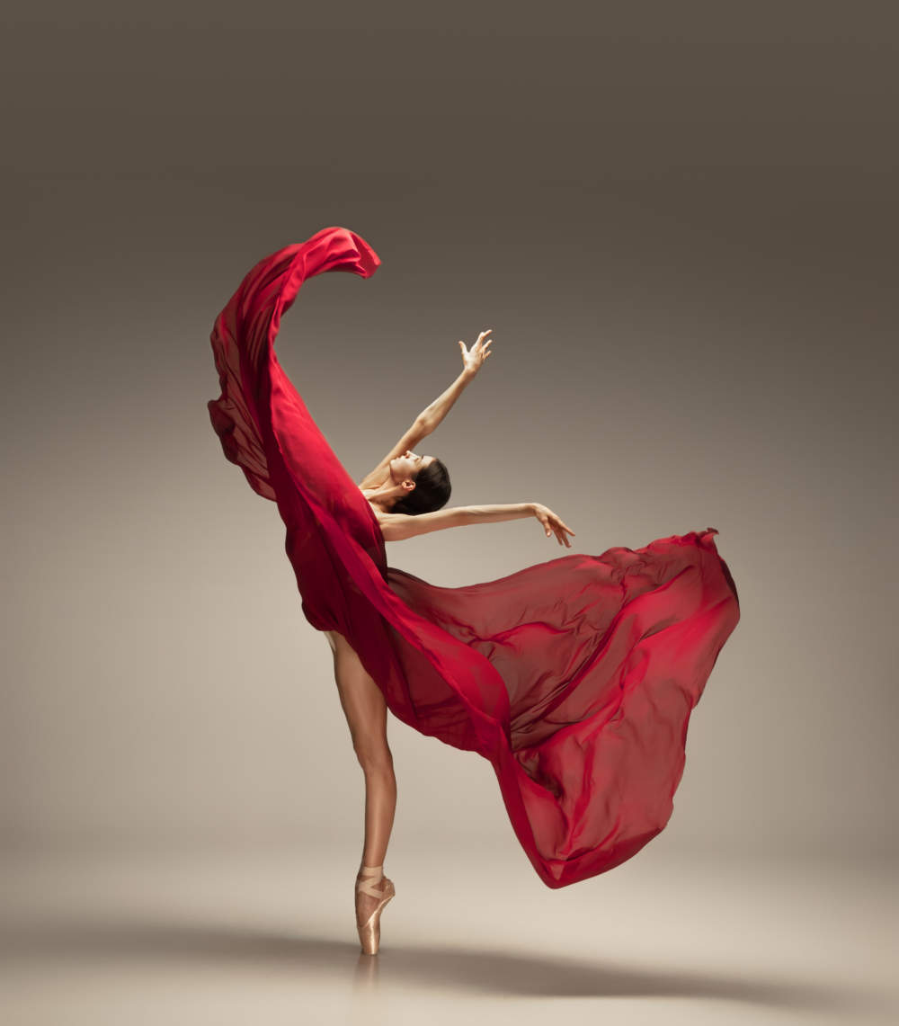 Young Graceful Tender Ballerina On Grey Studio Background