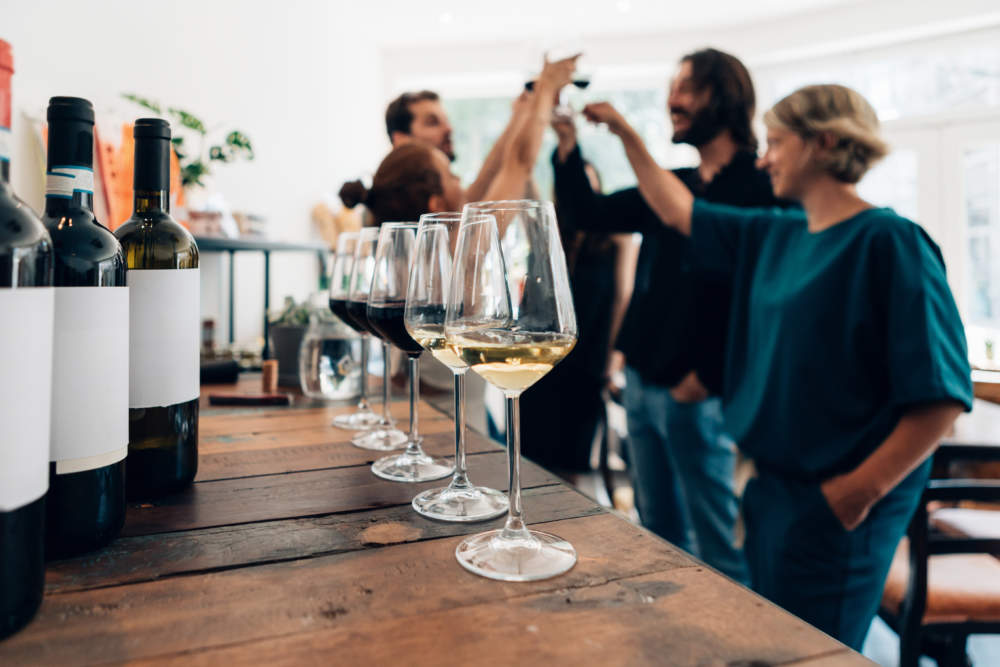 People Inside A Bar Chilling Out With A Drink Friends Talking And Drinking In A Winery Millennials Toasting At A Wine Tasting