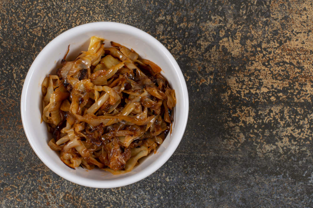 Caramelized Onion Pieces In White Bowl