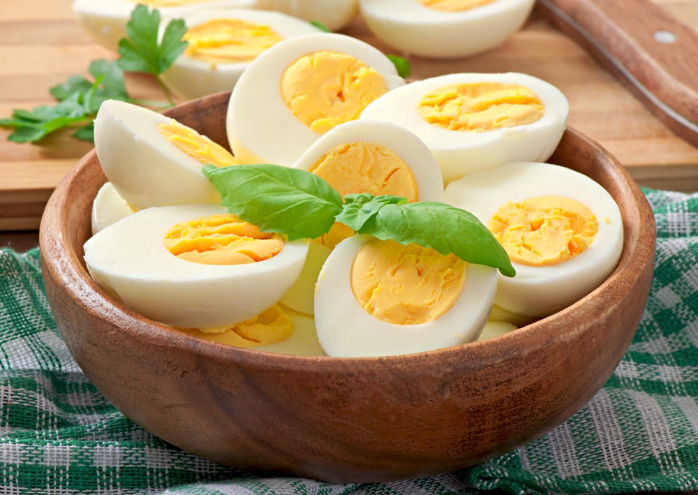 Boiled Eggs In A Bowl Decorated With Parsley Leaves