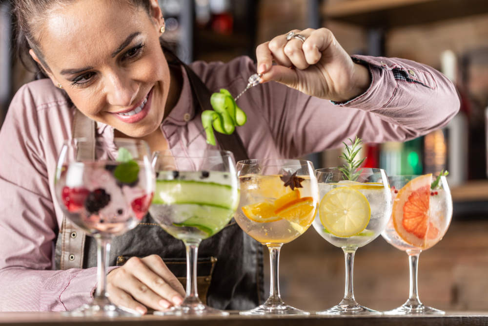 Bartender Makes Summer Refreshing Gin Tonic Cocktails On A Bar.