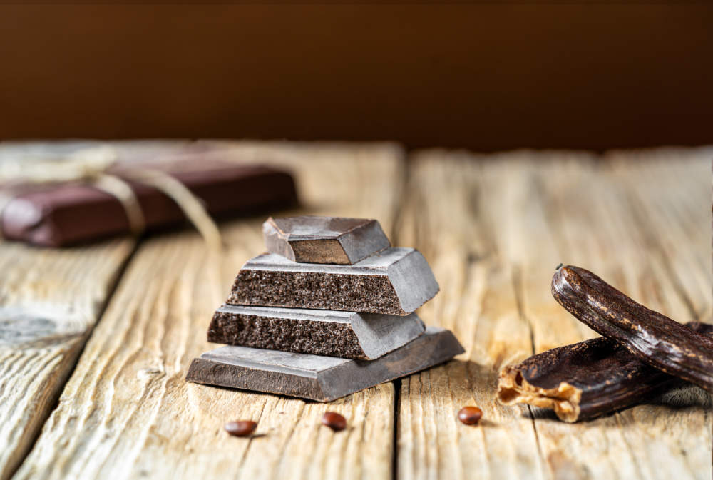 Carob Chocolate, Carob Pods With Seeds On Rustic Wooden Background