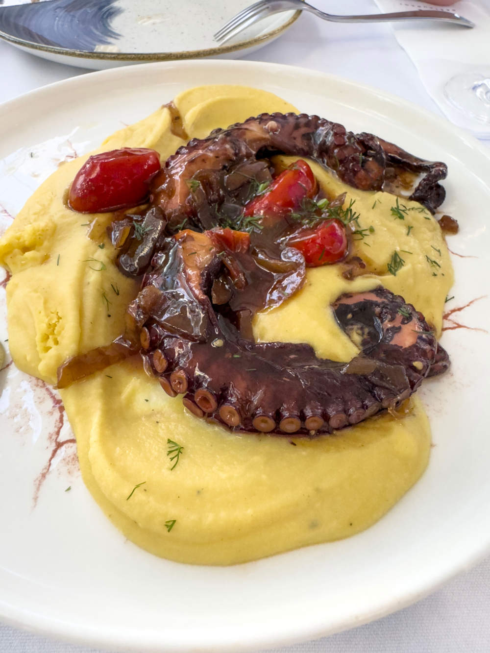 Grilled Galician Octopus Legs With Mashed Puree On Plate