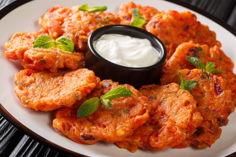 Tomatokeftedes Fried Tomato Balls A Delicious Greek Ouzo Meze From Santorini Island Close Up In A Plate. Horizontal